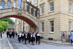 image of student walking under arch of a famous UK university