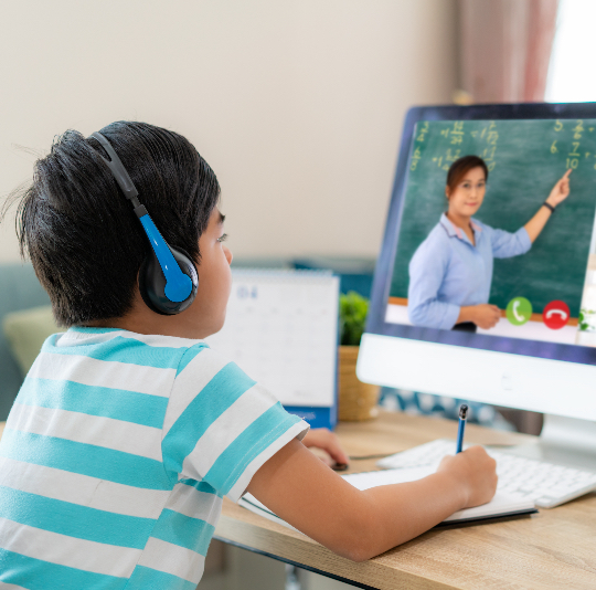 a young male student being tutored by an online tutor